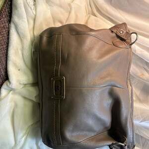 The Sak Gray Leather Shoulder Bag Hobo Style with Brass Hardware